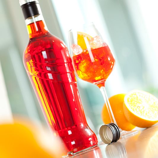 liquor bottle witch glas and screw cap