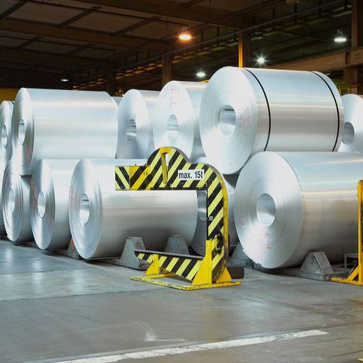 big aluminium rolls with workers