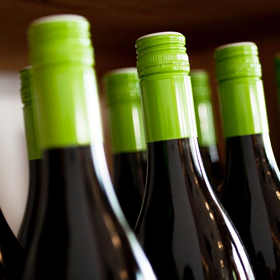 Wine bottles with green screw caps