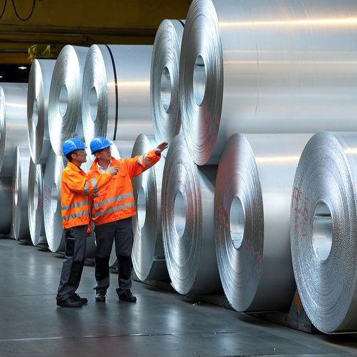 big aluminium rolls with workers