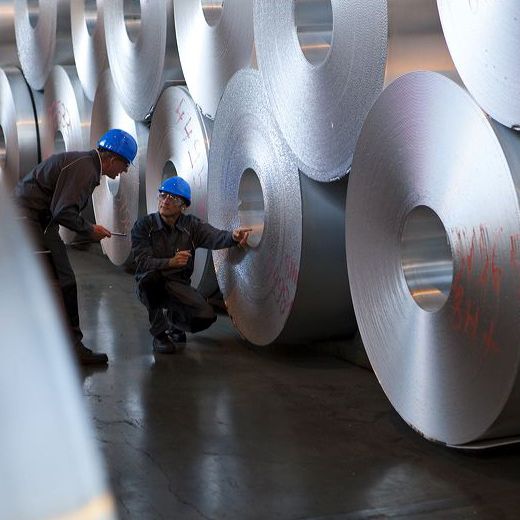 big aluminium rolls with workers