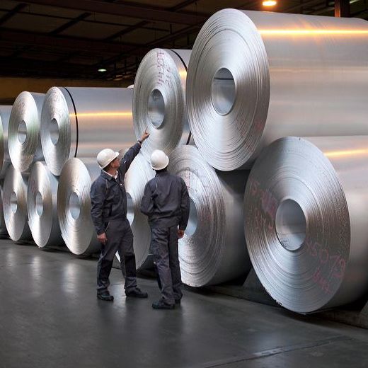 big aluminium rolls with workers