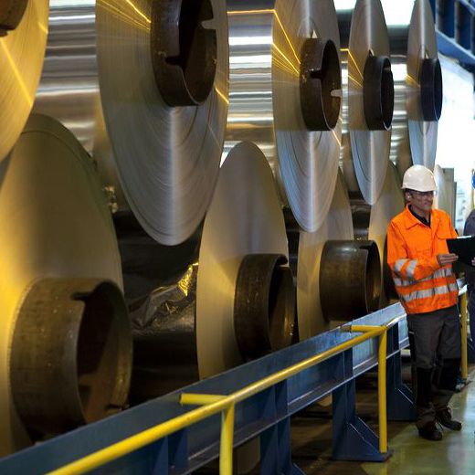big aluminium rolls with workers