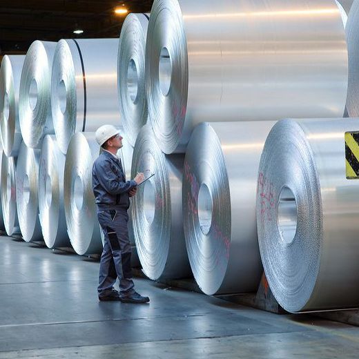 big aluminium rolls with worker