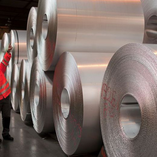 big aluminium rolls with workers